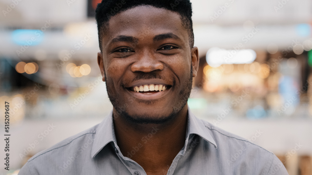 Male portrait close-up young surprised amazed african american man feeling shock surprise happy guy smiling nodding answers yes positive answer great decision choice agree expresses approval good idea