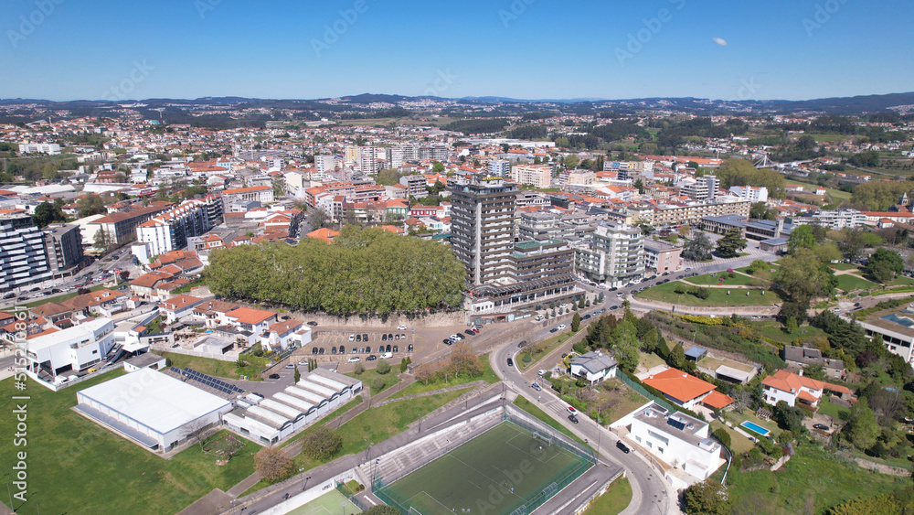 Santo Tirso, Portugal - April 3, 2022: DRONE AERIAL VIEW - Apartment buildings, 25th of April Square (Portuguese: Praca 25 de Abril) and Santo Tirso City Hall.