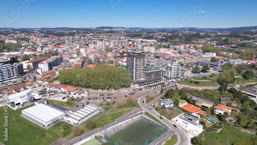 Obraz na płótnie Santo Tirso, Portugal - April 3, 2022: DRONE AERIAL VIEW - Apartment buildings, 25th of April Square (Portuguese: Praca 25 de Abril) and Santo Tirso City Hall. w salonie