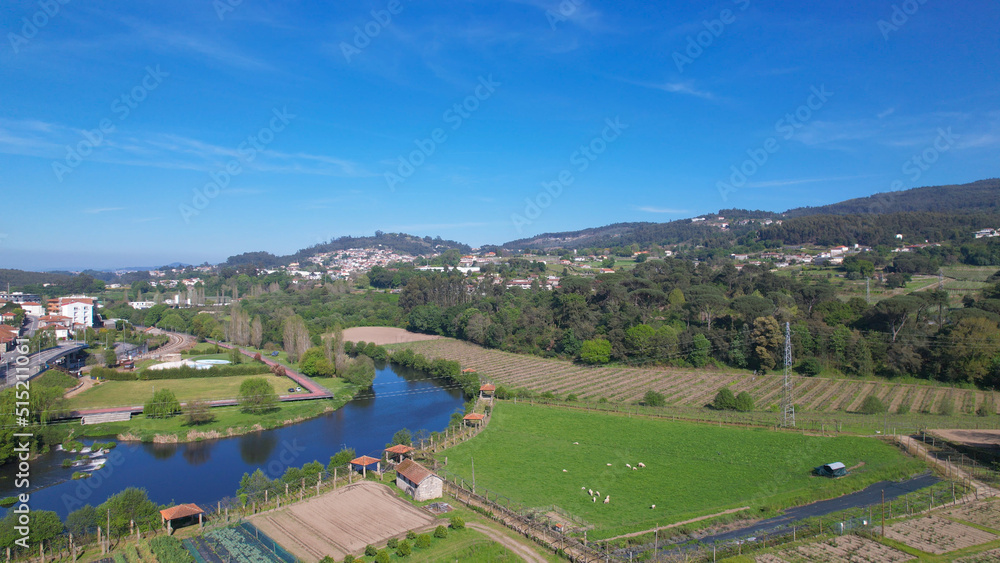 Aerial view of small waterfall on the Ave River in Santo Tirso, Portugal.