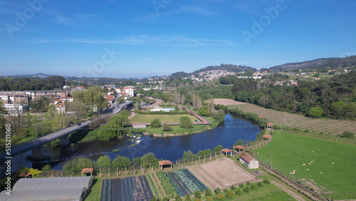 Aerial view of small waterfall on the Ave River in Santo Tirso, Portugal.