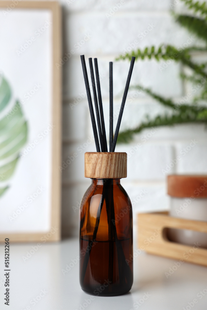 Air reed freshener on white table indoors