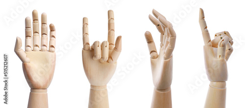 Set with wooden hands of mannequins showing different gestures on white background. Banner design photo