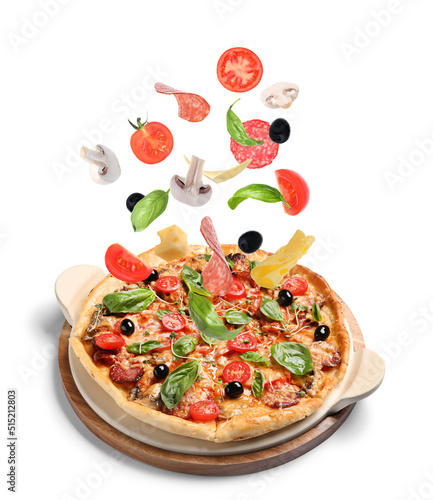 Delicious pizza and flying ingredients on white background