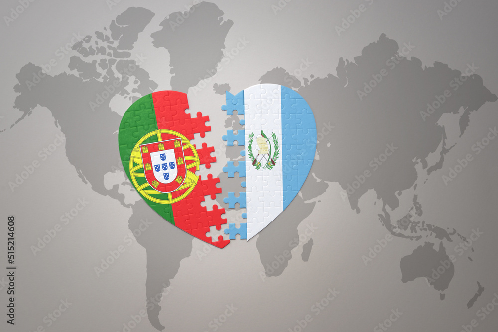puzzle heart with the national flag of portugal and guatemala on a ...