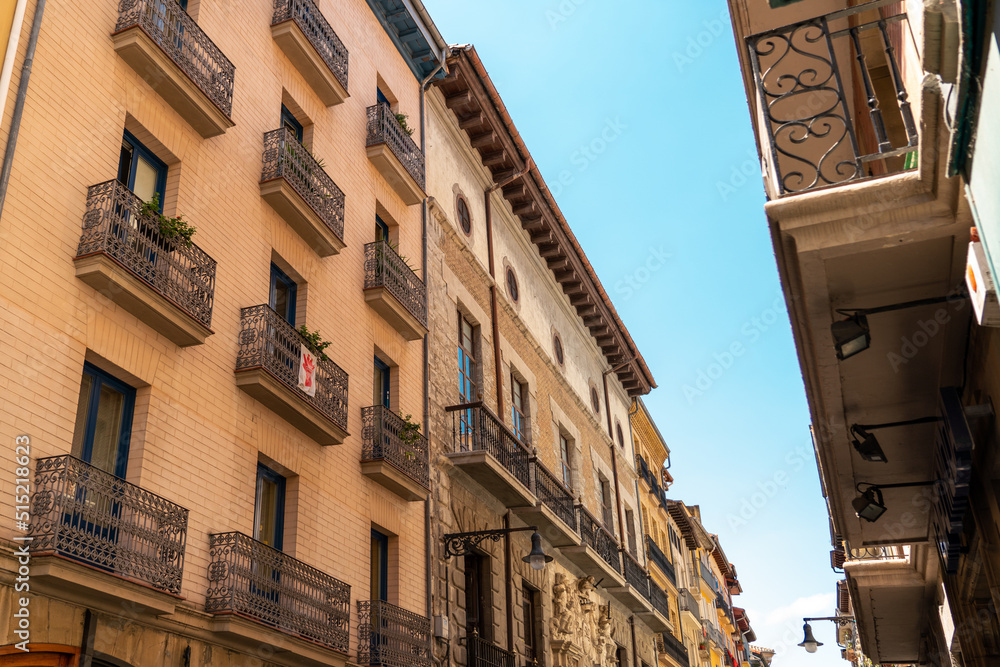 Beautiful building architecture in Pamplona city. Coloured buildings, beautiful façade typically for the Navara province, in north of Spain. City in preparation for the San Fermin party.