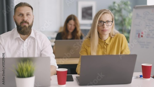 Wallpaper Mural Male and female workers sitting at desk and using modern computer for work. Focused financial analysts working with data in bright office. Business technology concept. Torontodigital.ca
