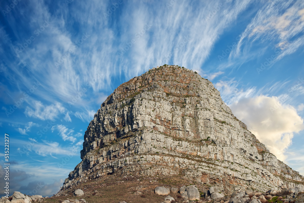 Copyspace with scenic landscape view of Lions Head mountain in Cape Town South Africa against a cloudy blue sky background from below. Magnificent panoramic of a famous attraction and iconic landmark