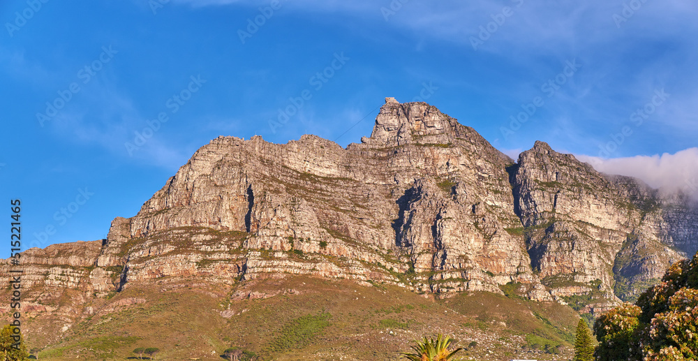Copy space with Table Mountain in Cape Town South Africa against a blue sky background from below. Beautiful and calm landscape view of an iconic landmark and famous travel destination on a sunny day Copy space with Table Mountain in Cape Town South Africa against a blue sky background from below. Beautiful and calm landscape view of an iconic landmark and famous travel destination on a sunny day