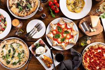 Variety of italian food on the table, pizza, pasta and appetizers