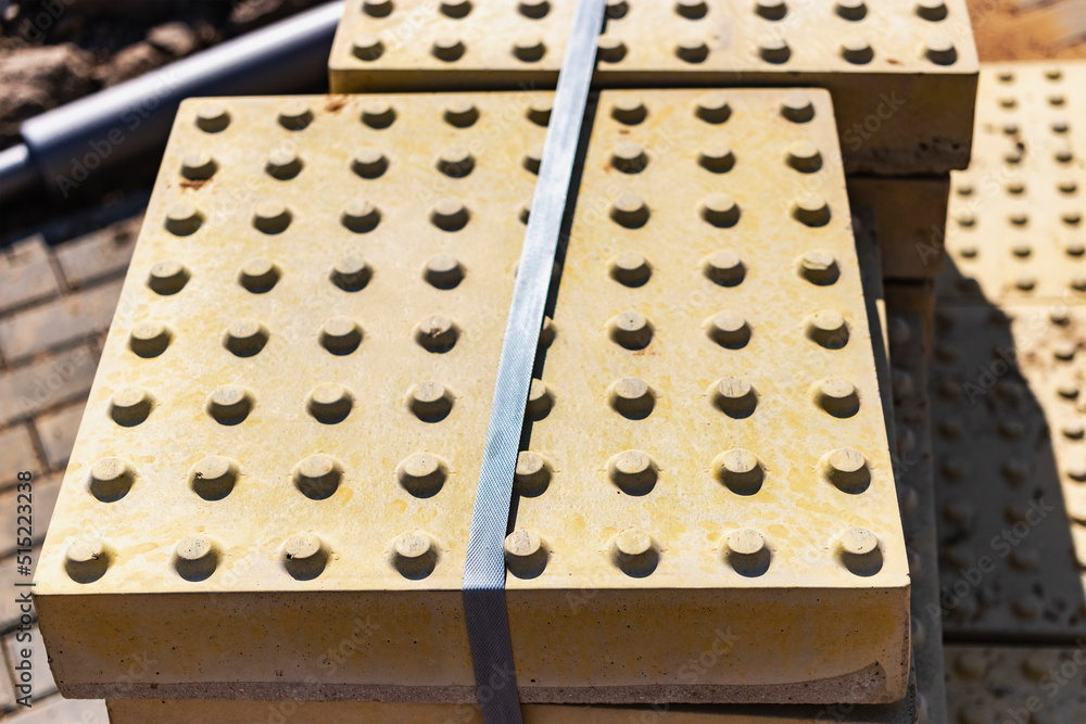 The tactile texture of paving slabs before being laid on the road. Protection of the blind on the sidewalk and walkways. The tactile texture of paving slabs before being laid on the road. Protection of the blind on the sidewalk and walkways.