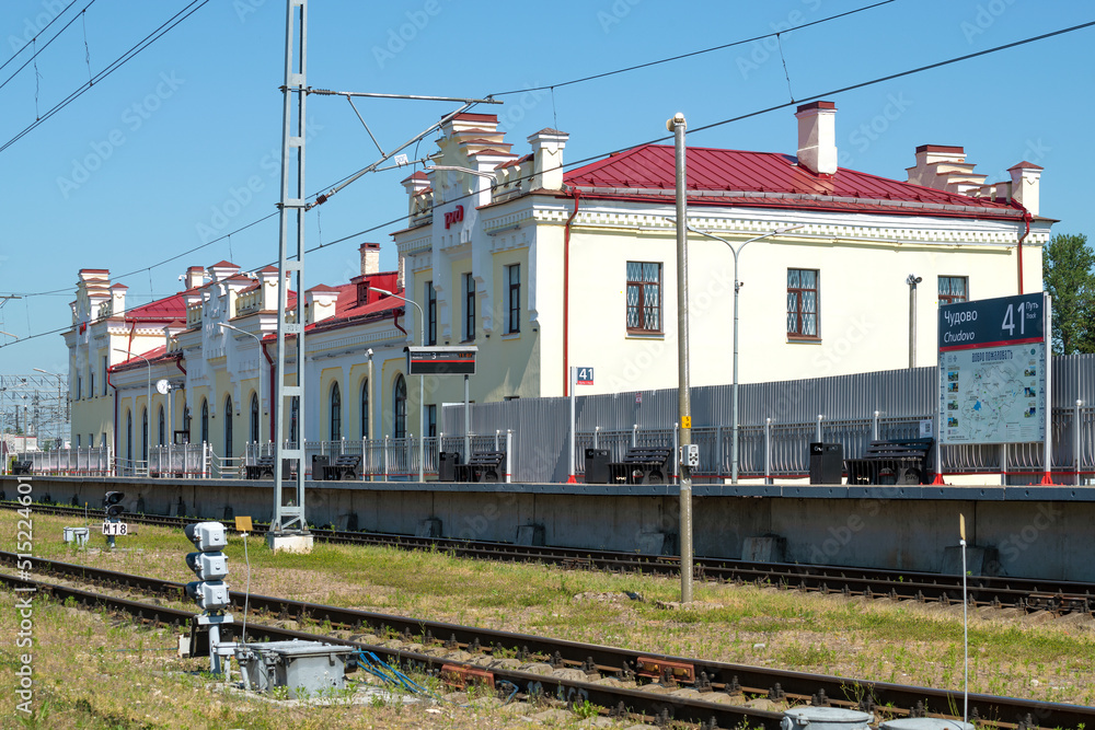 The ancient building of the railway station (1876) of Chudovo-Moskovskoye railway station on a sunny June day