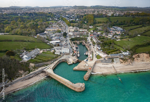Aerial view of Charletown Harbour from above showing ships in berth with view of town and St Austell clay mines in background, St Austell, Charlestown, Cornwall, United Kingdom. photo