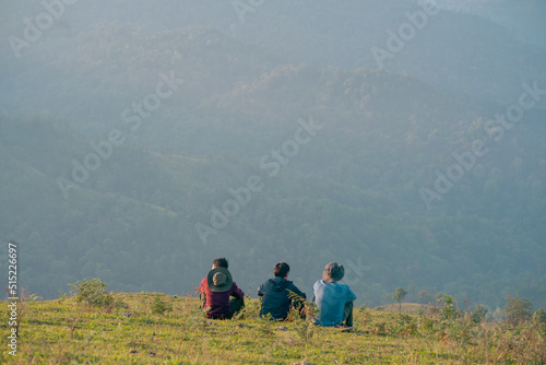 group of hiker man relax with wellbeing and happy feeling on top of mountain