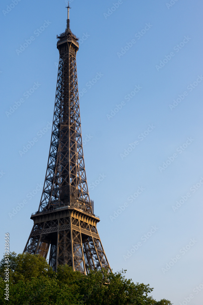 Part of the Eiffel Tower in Paris with the blue sky Part of the Eiffel Tower in Paris with the blue sky
