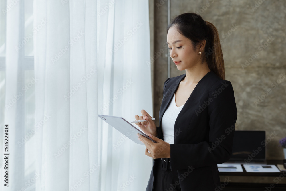 Beautiful Asian woman is a businesswoman who leads a new generation of startups, a woman who runs and manages a business plan to build confidence and stability in business, woman-led business concept. Beautiful Asian woman is a businesswoman who leads a new generation of startups, a woman who runs and manages a business plan to build confidence and stability in business, woman-led business concept.