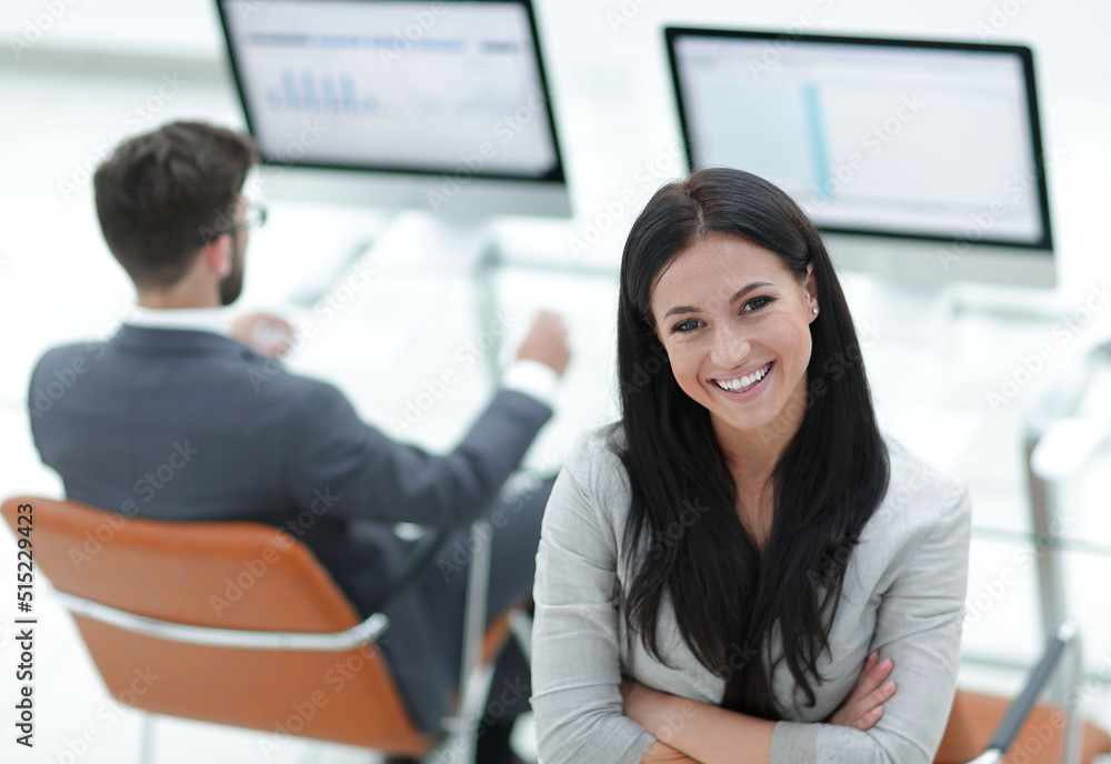 successful business woman on the background of a modern workplace successful business woman on the background of a modern workplace