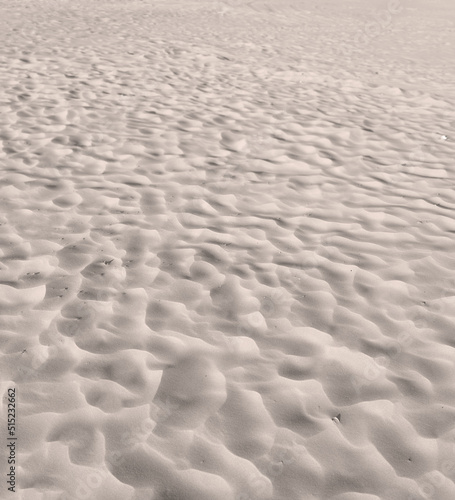 Beach sand from desert dunes with ripples along the coast in nature on a sunny day. Closeup of a scenic landscape on the seashore with copyspace background outdoors. A calm place to feel zen