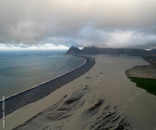 Aerial view of water formation at river estuary and Fjorur beach, Iceland. photo