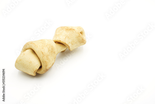 Carnaza bone for dogs to bite on, on a white background