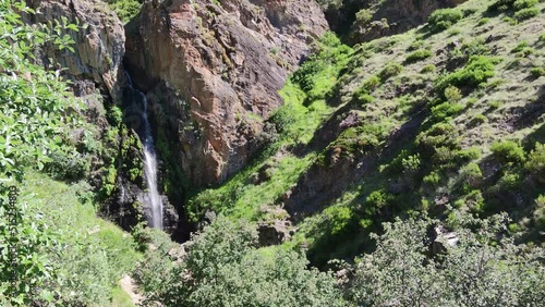La hermosa catarata de Mazobre durante el mes de julio en el parque natural de la montaña Palentina, España photo