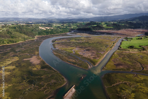 Aerial view of Punta Candelaria, a swamp with river in San Vicente de la Barquera, Cantabria, Spain. photo