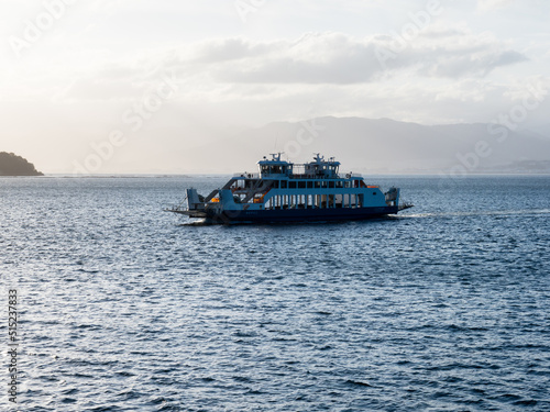 Hiroshima, Japan - August 25, 2018: Ferry boat crossing the Seto Inland Sea at Hiroshima bay at sunset