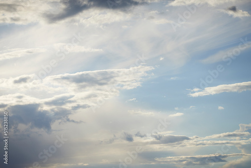 Blue sky with clouds and copy space during the day. Scenic view of dark, heavy storm rainclouds gathering in the distance. Atmosphere, global warming and climate change with stratus clouds and heaven