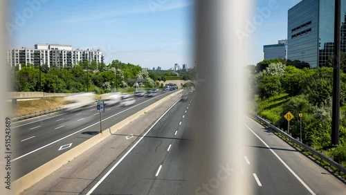 Slider time lapse of traffic on the Don Valley Parkway in Toronto during the daytime. photo