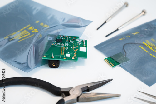 Sensitive electronic components in antistatic ESD packaging against electro static discharge and pulses with tools photo