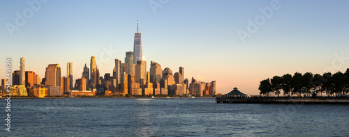 Lower Manhattan skyline and World Trade Center panoramic view at Sunset. Hudson River view of New York City from Hoboken