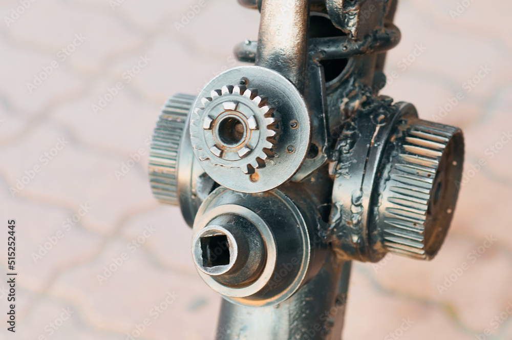 Details of a metal mechanism close up. rusty surfaces. Bolts, springs, levers and gears. Abstract industrial background. Selective focus. Details of a metal mechanism close up. rusty surfaces. Bolts, springs, levers and gears. Abstract industrial background. Selective focus.