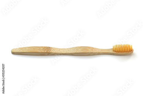wooden toothbrush on a white background, the concept of abandoning plastic, zero waste