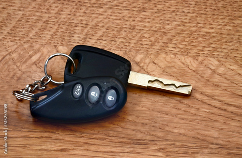 Black car keys on wooden background