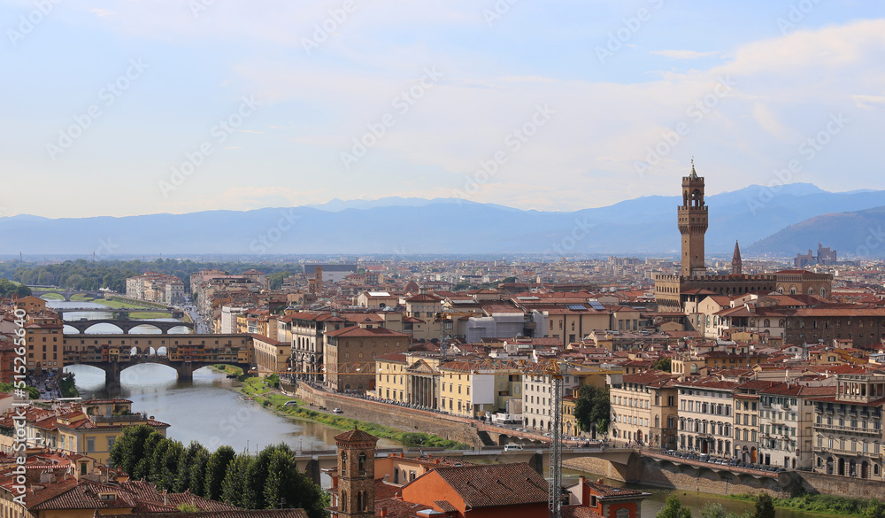 Tower of Old Palace and Arno River with Ponte Vecchio that means OLD BRIDGE in Florence in Italy