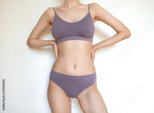 Slim woman in sports underwear. Female body. The body of a woman. Beautiful body. Fitness. Slimming. © Vinifera Art