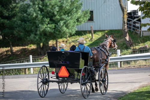 Amish man with his three children in a horse and buggy at an intersection   Holmes County, Ohio, near the Ashery Country Store © Isaac