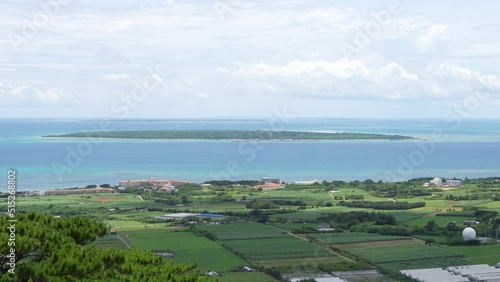 Okinawa,Japan - July 3, 2022: Taketomijima or Taketomi island viewed from Ishigakijima island, Okinawa, Japan
 photo