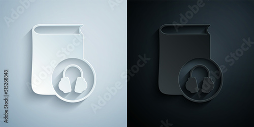 Paper cut Audio book icon isolated on grey and black background. Book with headphones. Audio guide sign. Online learning concept. Paper art style. Vector