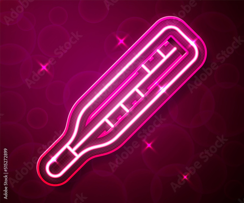 Glowing neon line Medical thermometer for medical examination icon isolated on red background. Vector