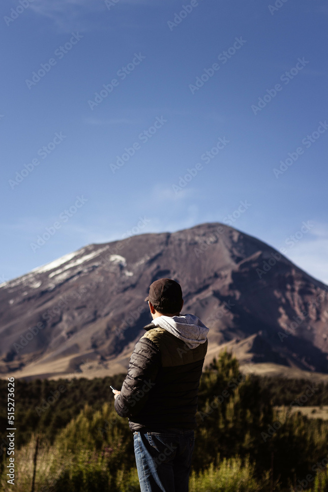Person looking at the mountain.
