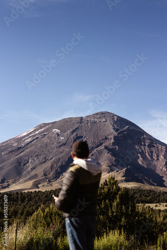 Person looking at the mountain.
