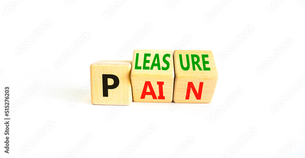 Pain or pleasure symbol. Concept words Pain or Pleasure on wooden cubes. Beautiful white table white background. Business and pain or pleasure concept. Copy space. Pain or pleasure symbol. Concept words Pain or Pleasure on wooden cubes. Beautiful white table white background. Business and pain or pleasure concept. Copy space.