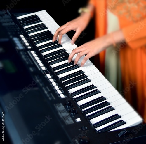 Playing musical keyboard closeup shot