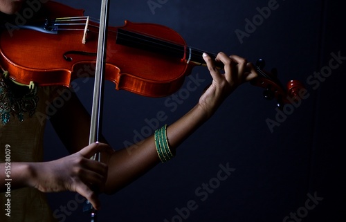 Playing violin closeup shot