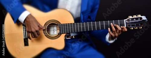 Playing guitar closeup shot
