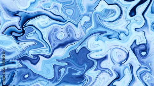 Liquid paint marbling effect. Blue abstract background