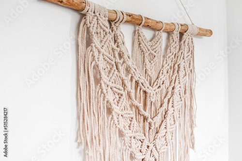 threads in the style of macrame on a white background