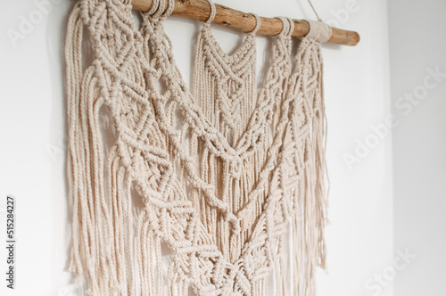 threads in macrame style on white background