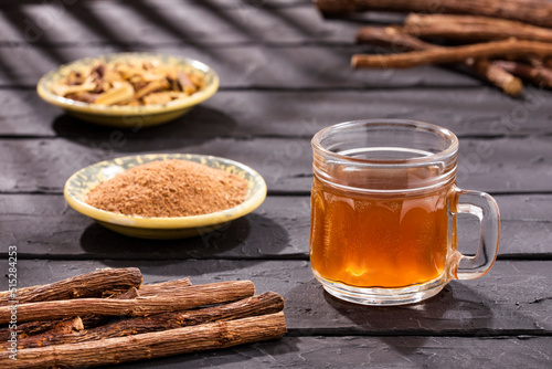 Glycyrrhiza glabra - Licorice roots with hot drink photo